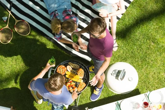 Friends at barbecue - Image by Ground Picture / Shutterstock.com